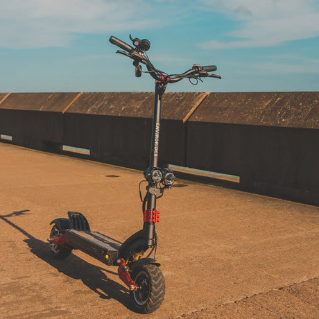 Electric scooter parked beside an industrial building