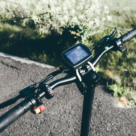 Close-up of electric scooter handlebars and display